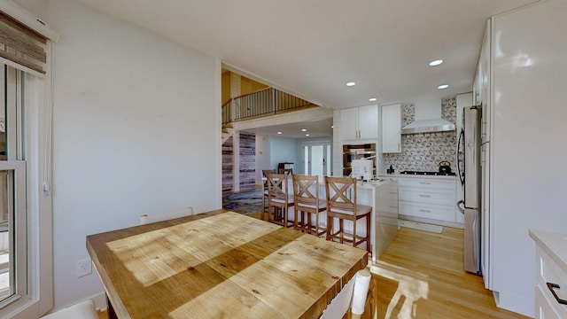 dining space featuring light hardwood / wood-style floors