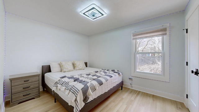 bedroom with light wood-type flooring