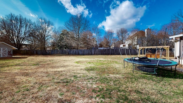 view of yard featuring a trampoline