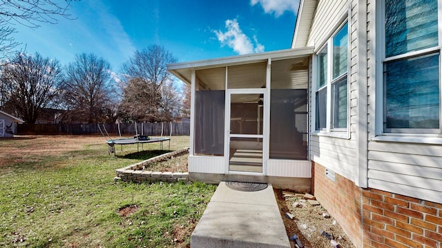 property entrance featuring a lawn