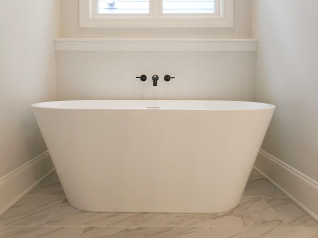 bathroom featuring a washtub