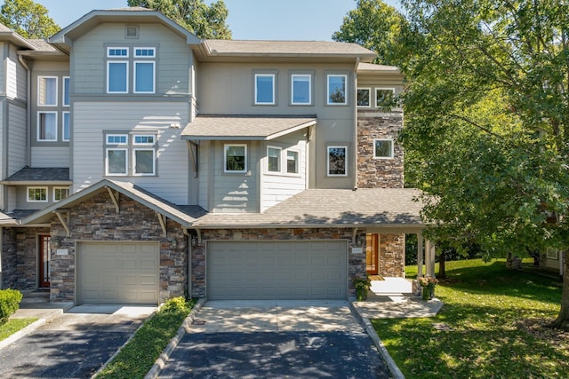 townhome / multi-family property featuring a garage