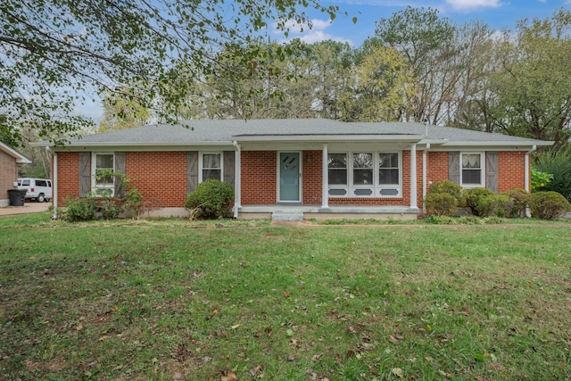 ranch-style home with a front lawn