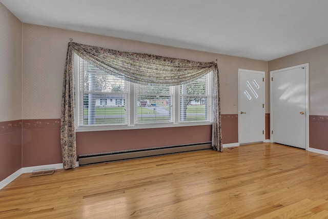 entryway featuring light hardwood / wood-style flooring and a baseboard radiator