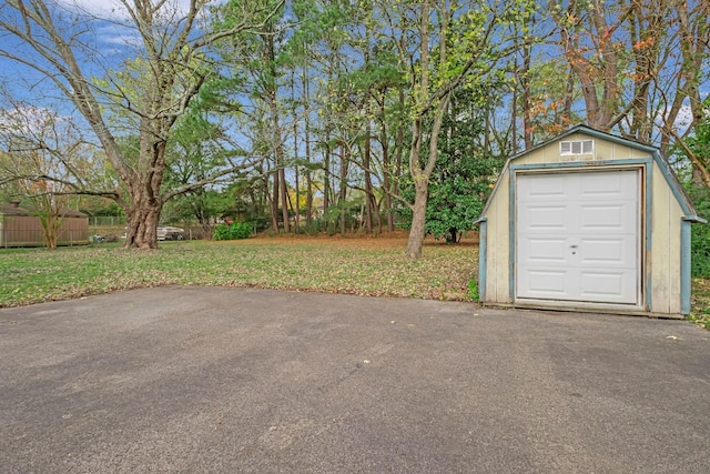 garage featuring a yard