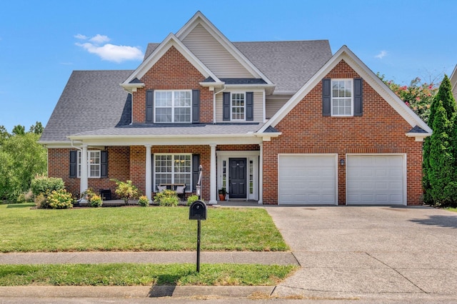 view of front of home featuring a garage and a front lawn