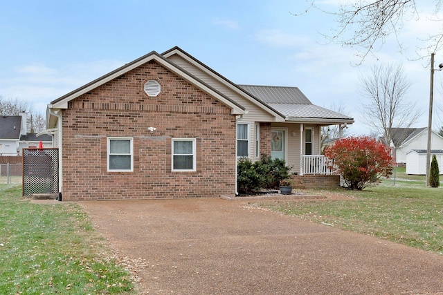 view of front of home featuring a front lawn and a porch