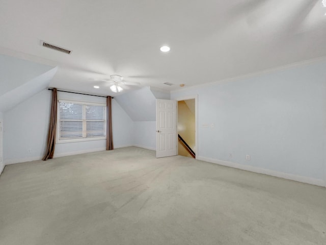 bonus room featuring ceiling fan, light carpet, and lofted ceiling