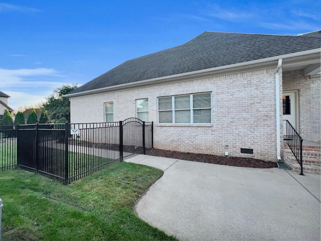 view of property exterior with a yard