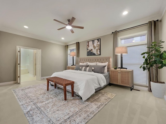 bedroom with ceiling fan, ornamental molding, and ensuite bathroom