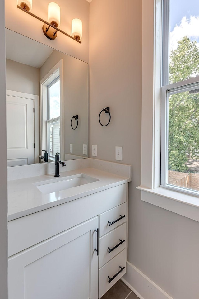 bathroom with tile patterned floors and vanity