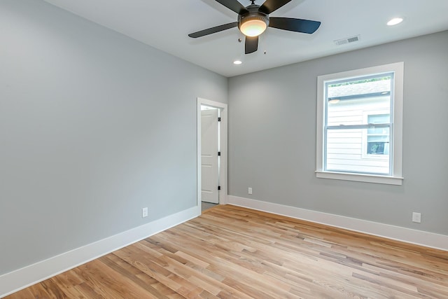 unfurnished room featuring light hardwood / wood-style floors and ceiling fan