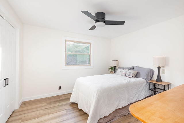 bedroom with ceiling fan and light wood-type flooring