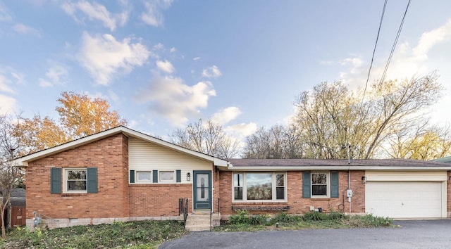 ranch-style home featuring a garage