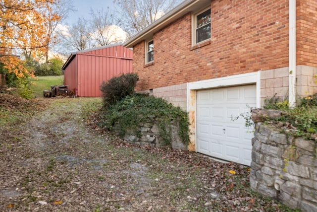 view of side of home featuring a garage