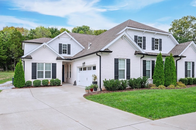 view of front of home featuring a front yard and a garage