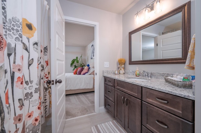 bathroom featuring vanity, tile patterned floors, and walk in shower