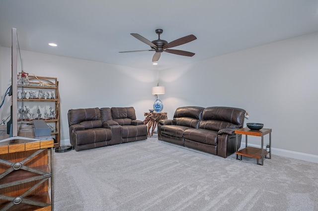 living room with carpet flooring and ceiling fan