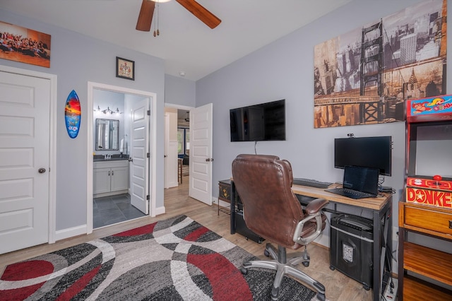 office featuring ceiling fan, hardwood / wood-style floors, and sink