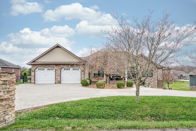 view of front of home with a front yard and a garage