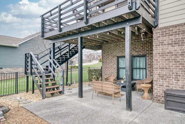 view of patio with an outdoor living space and a deck