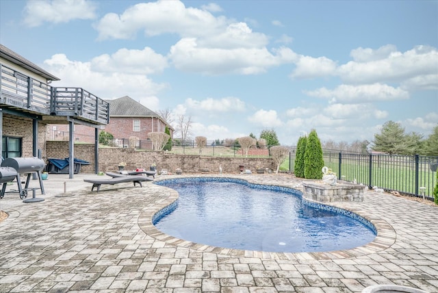 view of swimming pool with a patio and grilling area