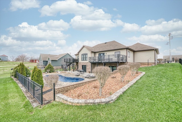 back of property with a patio area, a yard, and a pool side deck