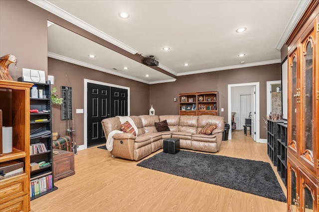 living room with light wood-type flooring and crown molding