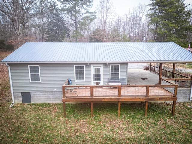 rear view of house featuring a patio and a wooden deck