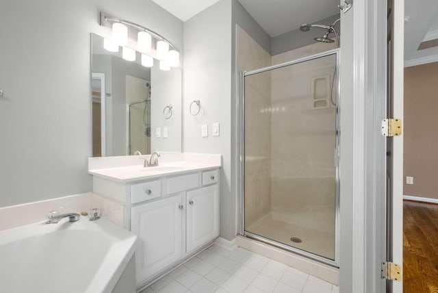 bathroom featuring shower with separate bathtub, vanity, and tile patterned floors