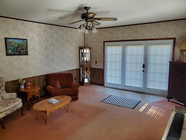 2055 Chisholm Rd, Iron City, TN 38463 - carpeted living room featuring wainscoting, a ceiling fan, wood walls, and wallpapered walls