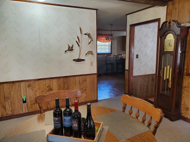 2055 Chisholm Rd, Iron City, TN 38463 - dining room featuring wood walls, wallpapered walls, and carpet floors