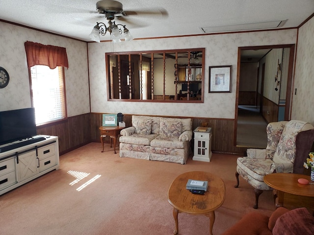 2055 Chisholm Rd, Iron City, TN 38463 - living area with wallpapered walls, wainscoting, a ceiling fan, a textured ceiling, and crown molding