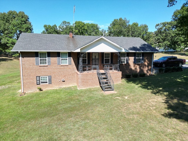 view of front of property with a porch and a front yard