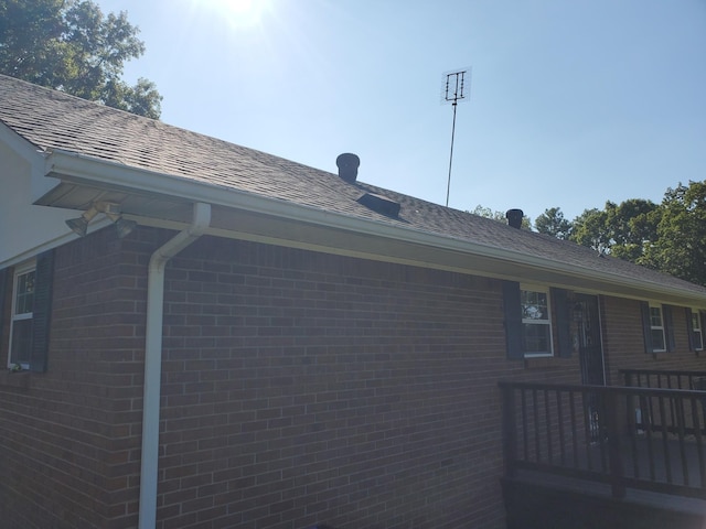 2055 Chisholm Rd, Iron City, TN 38463 - view of home's exterior featuring brick siding and a wooden deck
