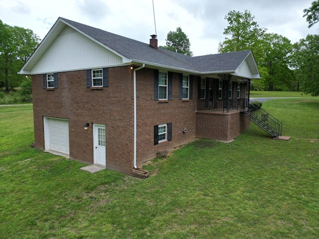2055 Chisholm Rd, Iron City, TN 38463 - view of side of home with a chimney, an attached garage, a lawn, covered porch, and roof with shingles