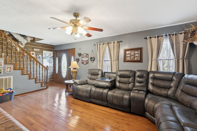 living room with ceiling fan and wood-type flooring