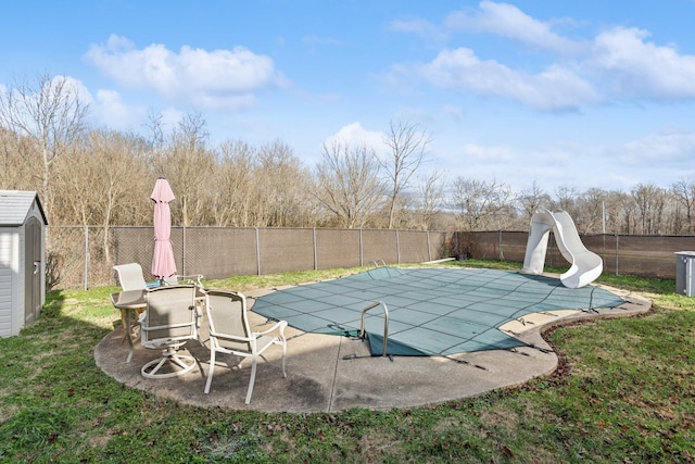 view of pool featuring a patio and a water slide