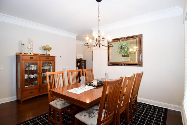 dining room featuring a chandelier and crown molding