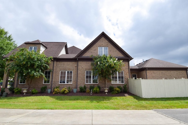 craftsman-style home with a front yard