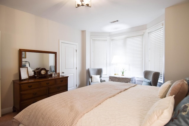 bedroom with an inviting chandelier