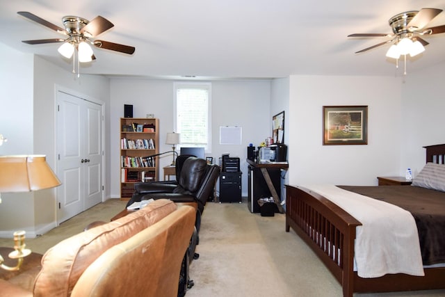 bedroom featuring light colored carpet and ceiling fan