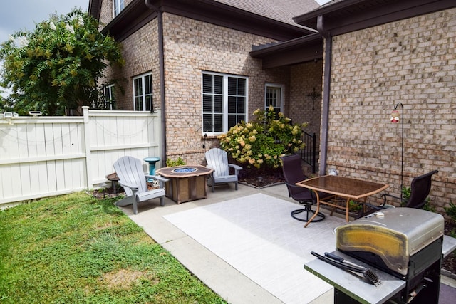 view of patio featuring a fire pit and area for grilling