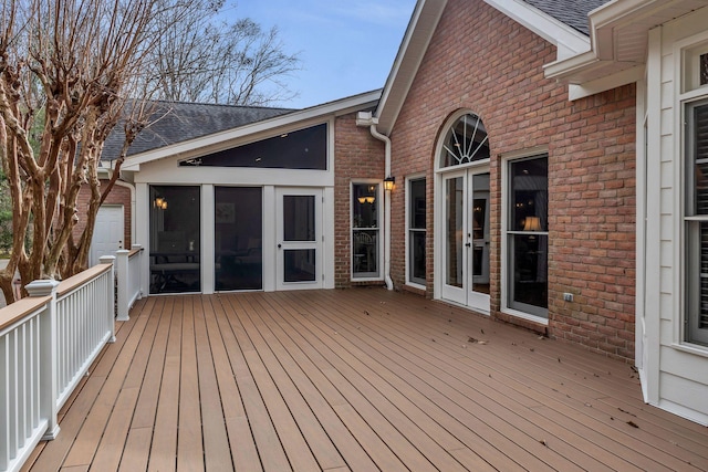 wooden deck featuring a sunroom