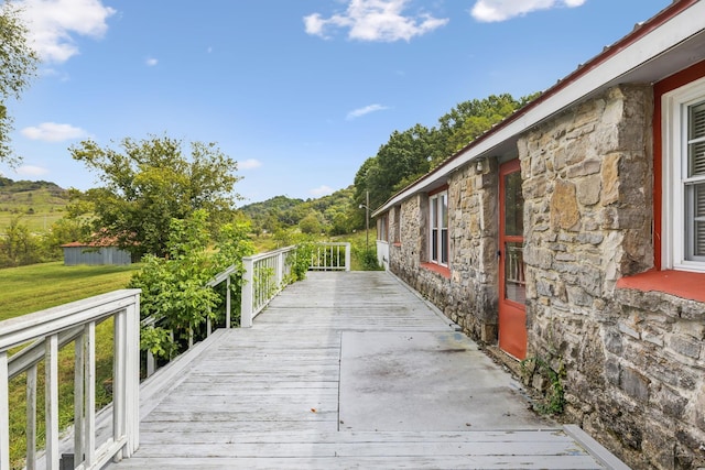 exterior space with a deck and a yard