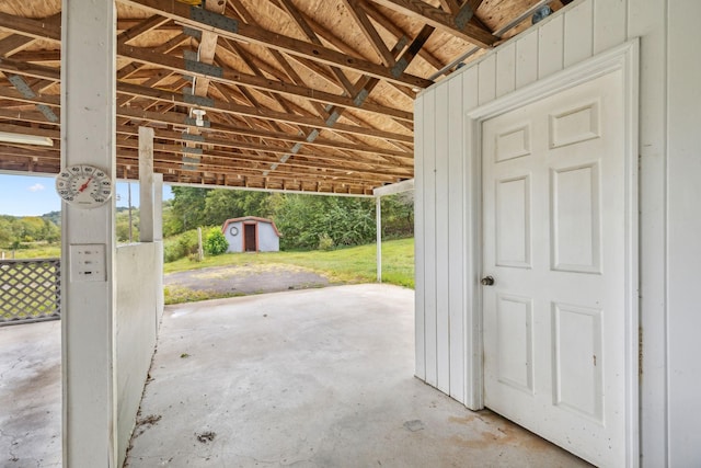 view of patio featuring a storage unit