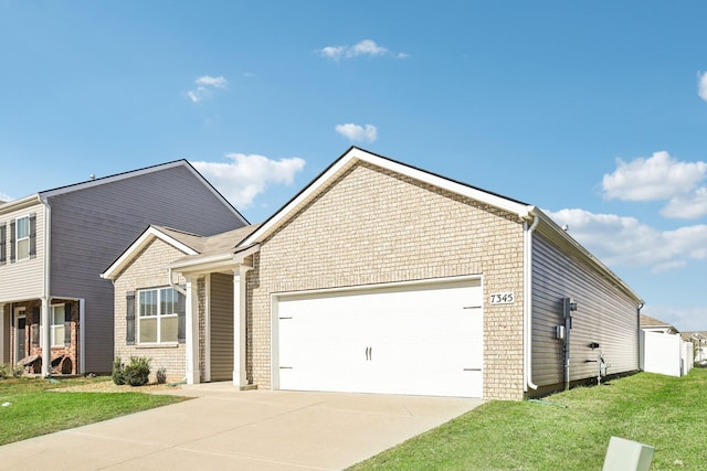 view of front of house with a garage and a front lawn