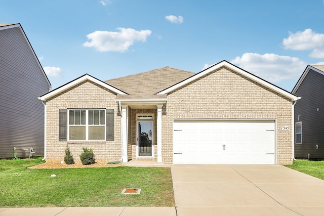 view of front of house featuring a garage and a front lawn