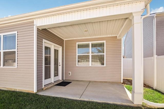 entrance to property featuring a patio area