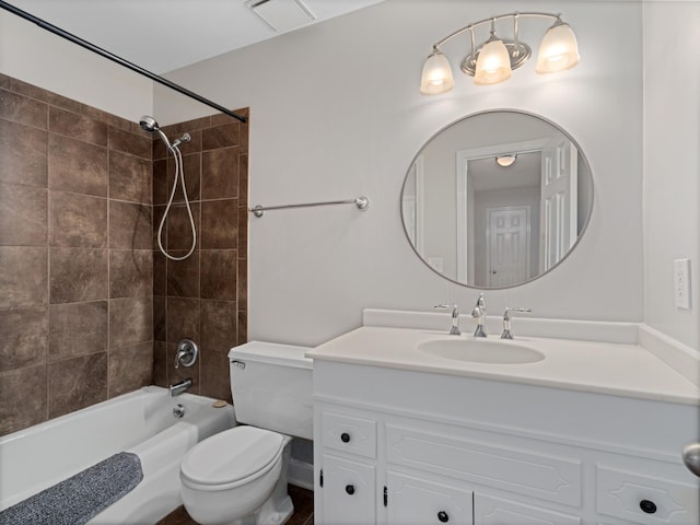 full bathroom featuring vanity, toilet, and tiled shower / bath